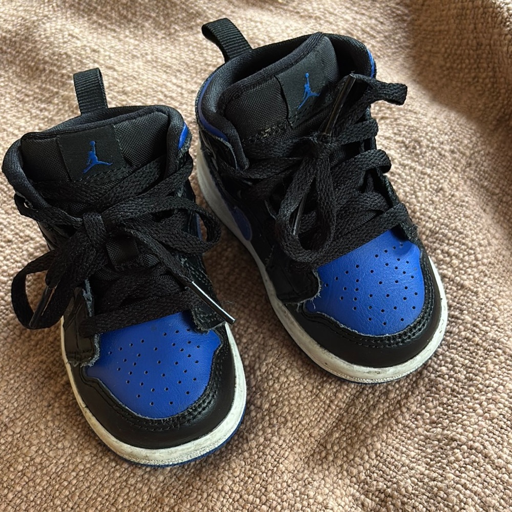 Nike Air Jordan’s Black and Blue High-Top Sneakers with Padded Collar
